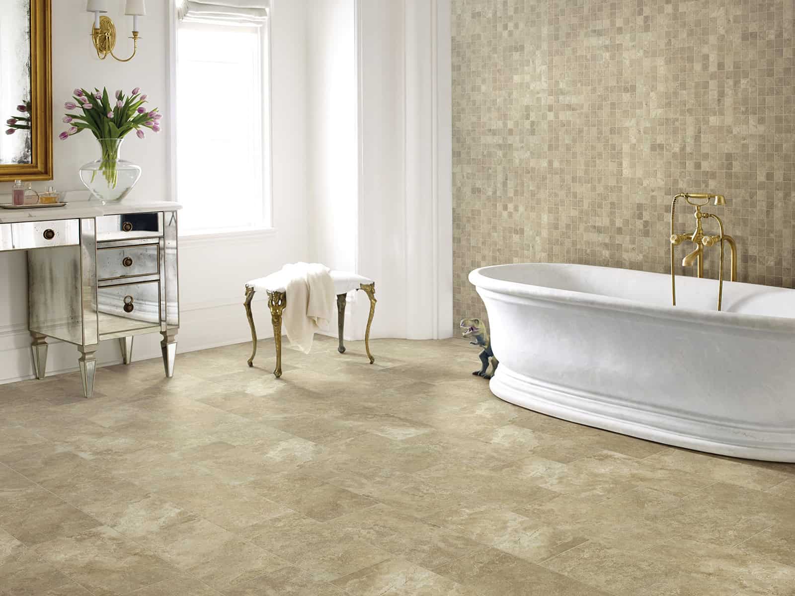 Bathroom with a white tub and stool.